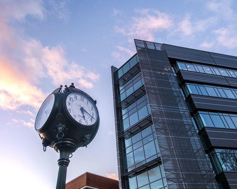 Sunset on the Mason Alumni Clock and Horizon Hall on the Fairfax campus